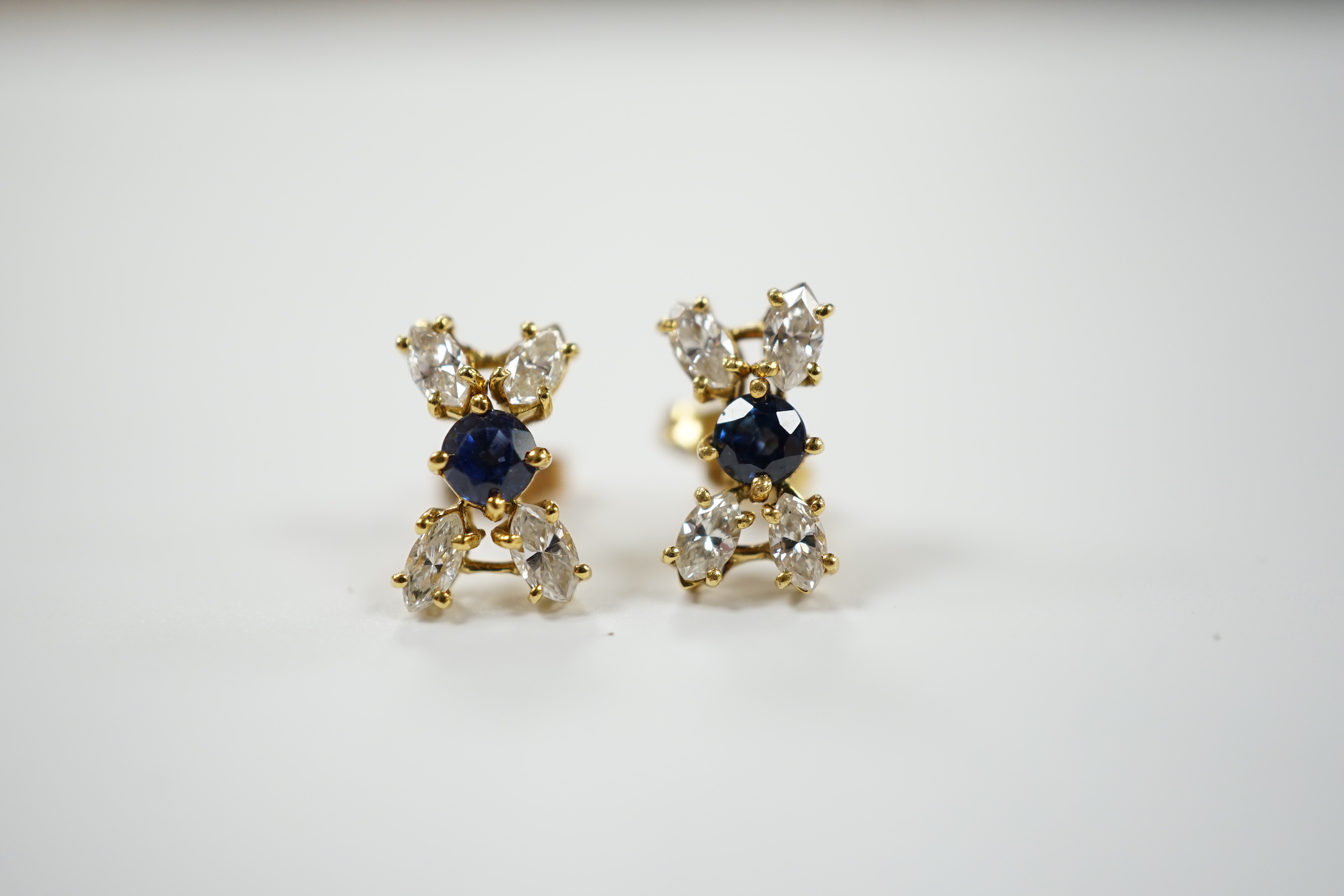 A modern pair of 18ct gold, sapphire and diamond cluster set 'X' ear studs, 12mm, gross weight 2.2 grams.